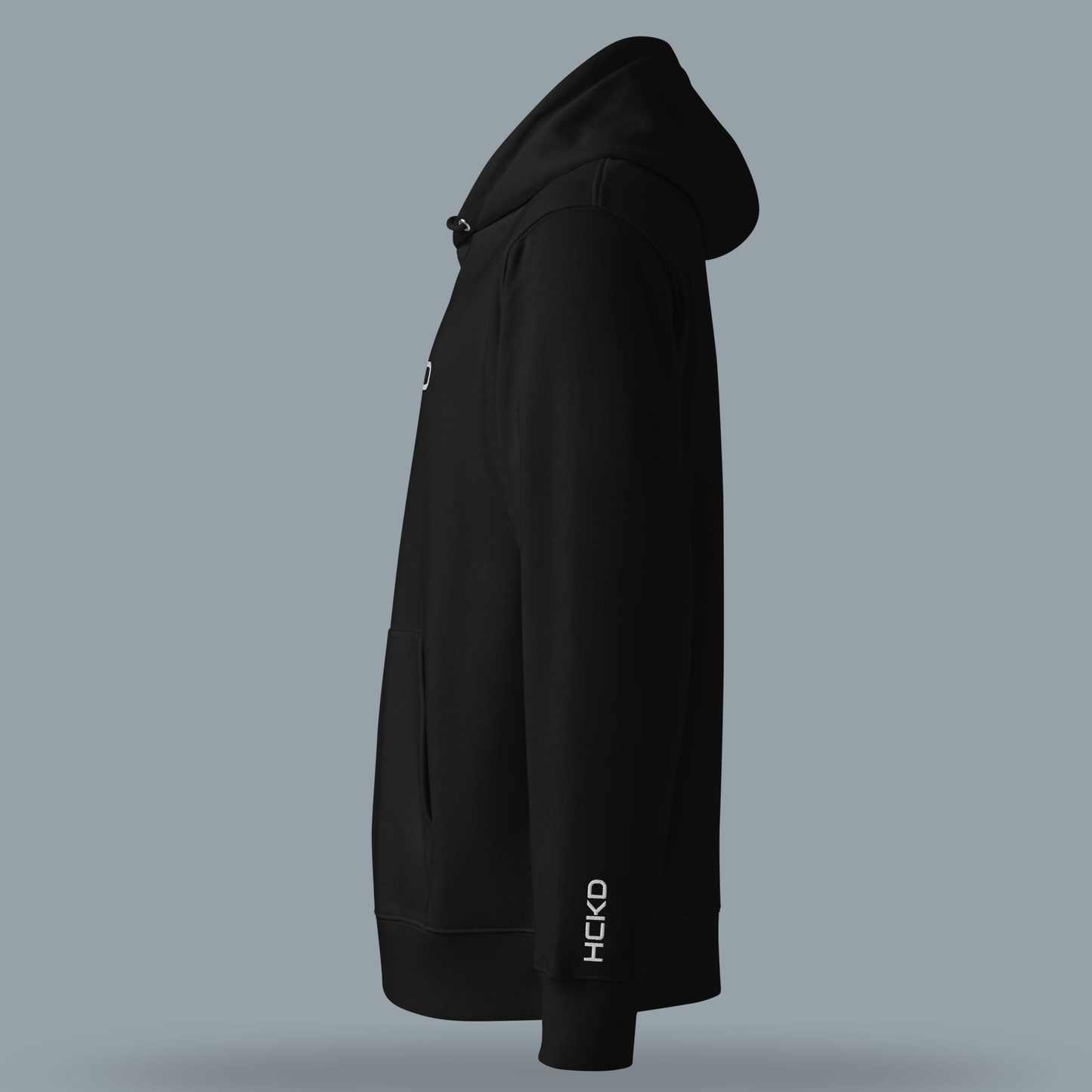 Side view of HCKD HOOD-01 hoodie in black, featuring a modern fit and classic kangaroo pocket.
