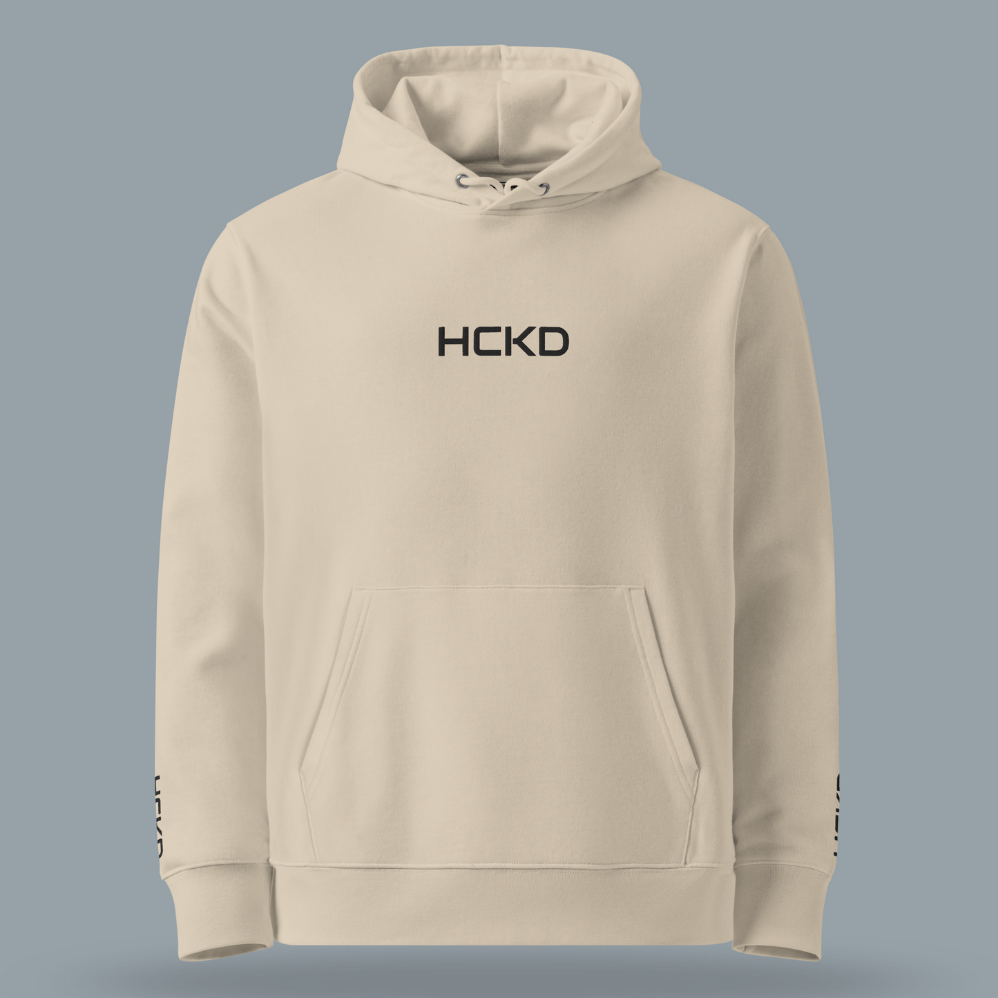 HCKD HOOD-01 hoodie in beige featuring logo, kangaroo pocket, and double-layered hood for all-day comfort.
