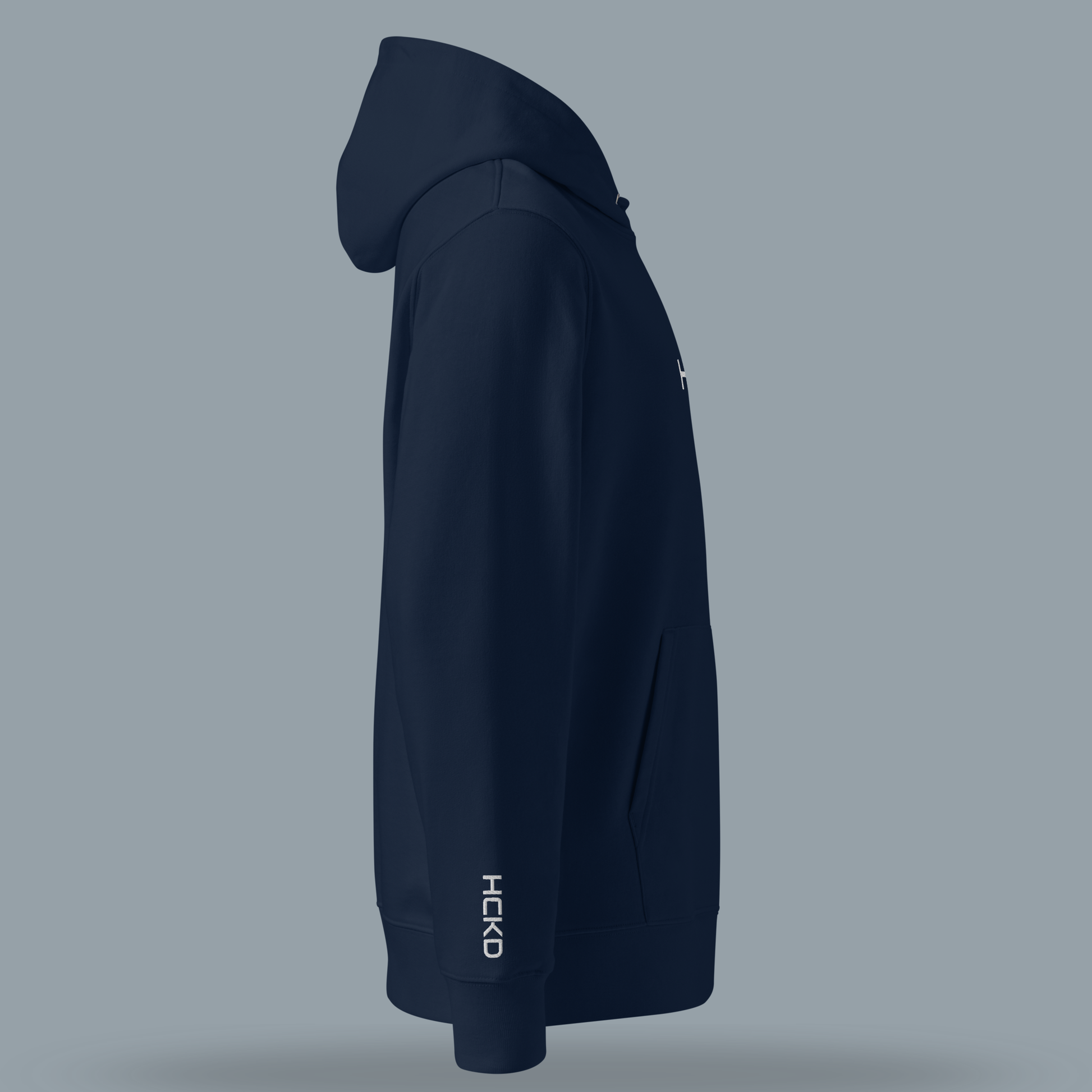 Side view of the HCKD HOOD-01 hoodie in navy blue, showcasing its modern fit and double-layered hood.