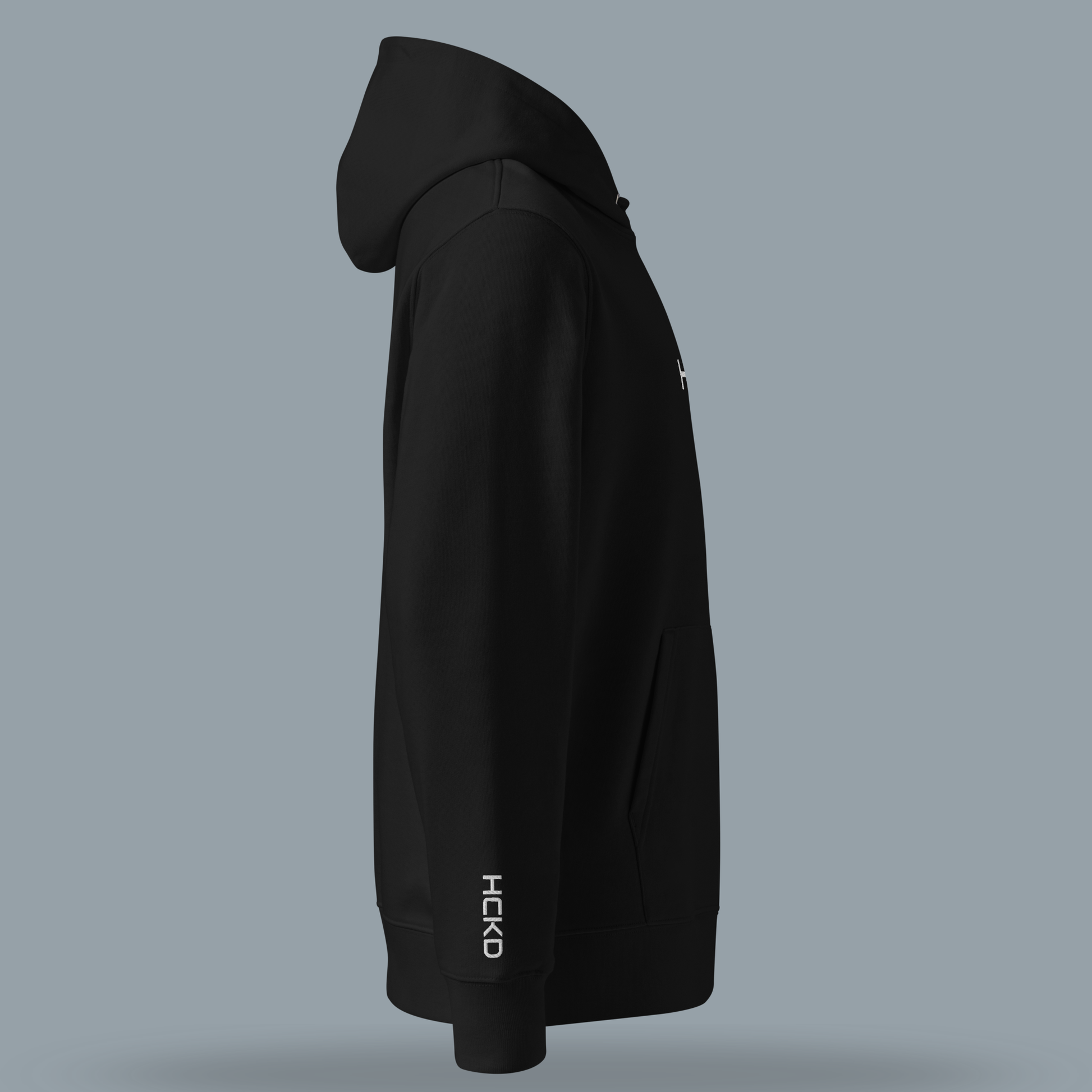 HCKD HOOD-01 black hoodie side view showcasing modern fit, double-layered hood, and kangaroo pocket.