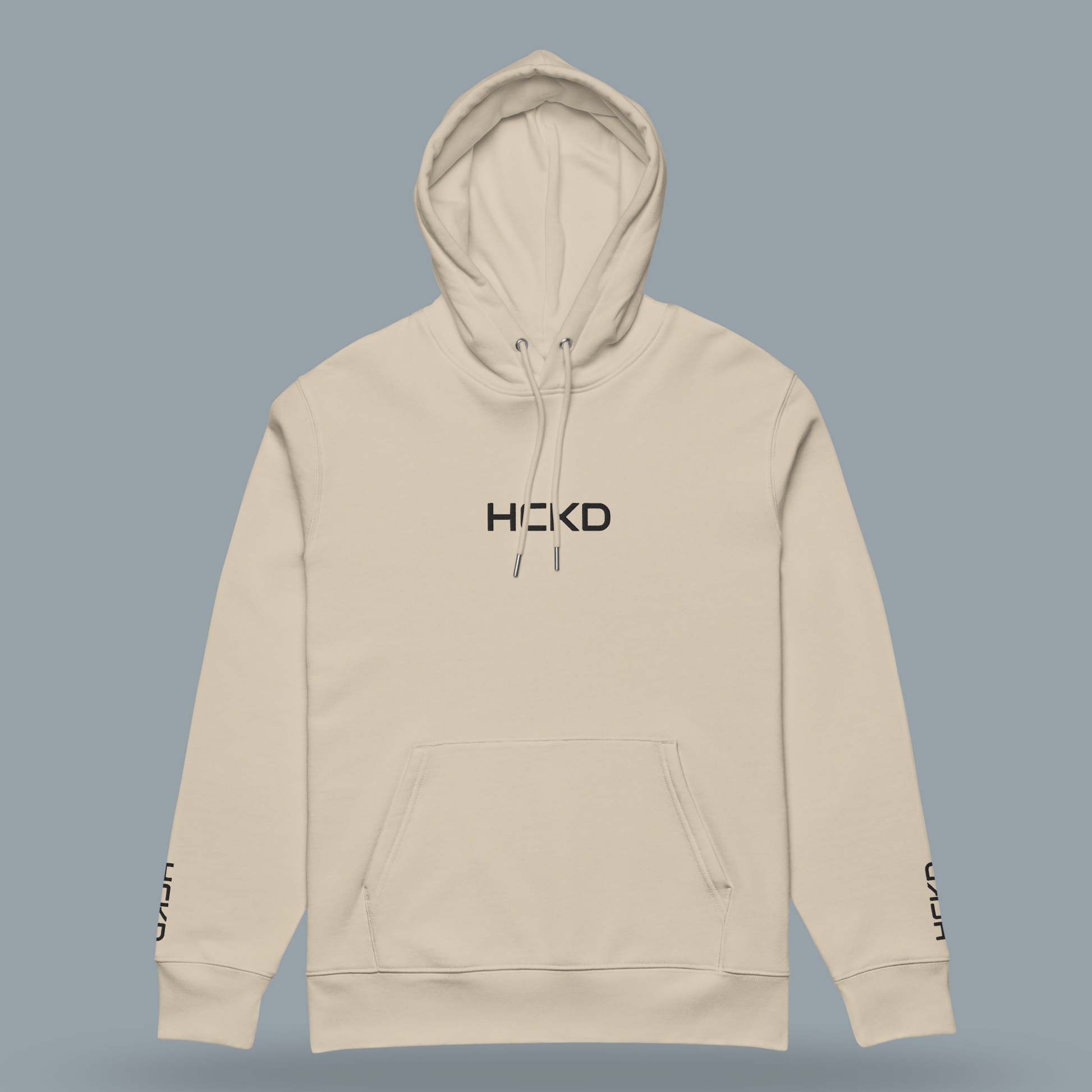 Light beige HCKD HOOD-01 hoodie featuring a modern fit, kangaroo pocket, and double-layered hood.